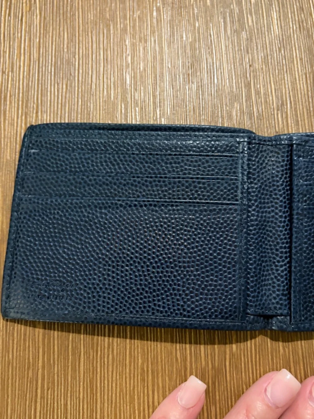 Salvatore Ferragamo men's textured leather bifold wallet with Gancini logo